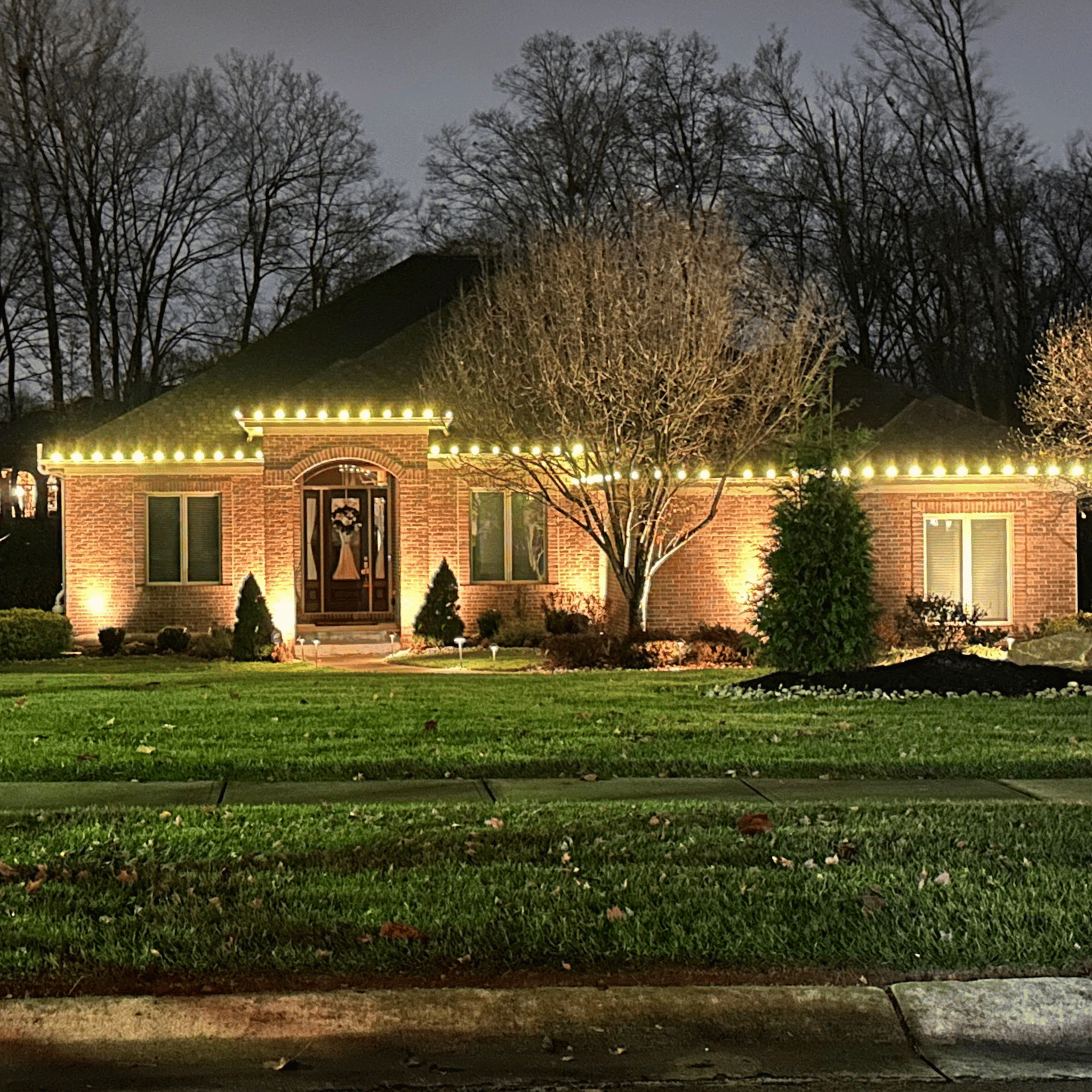 professional christmas lighs installation on roofline of house